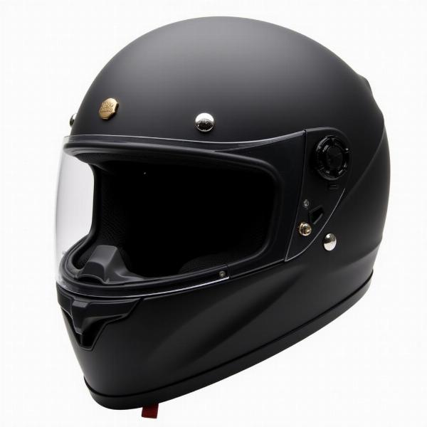 Casque moto anglais modulable noir mat avec visière solaire intégrée.