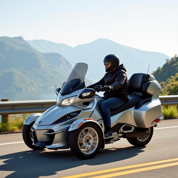 Can-Am Spyder RT Limited en mouvement sur une route panoramique, mettant en avant son design élégant et sa capacité de grand tourisme.