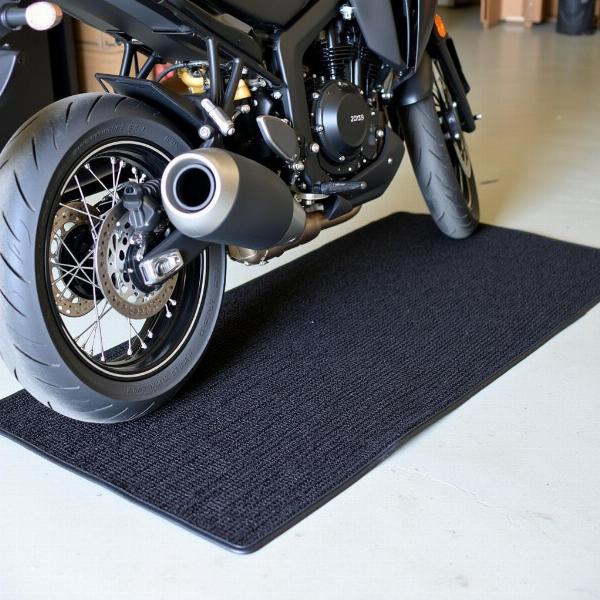 Tapis environnemental pour moto Honda offrant une protection optimale contre les fuites